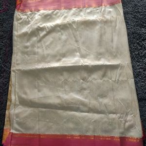 New Silk Saree. Never wore, comes with a stitched blouse that fits small/medium